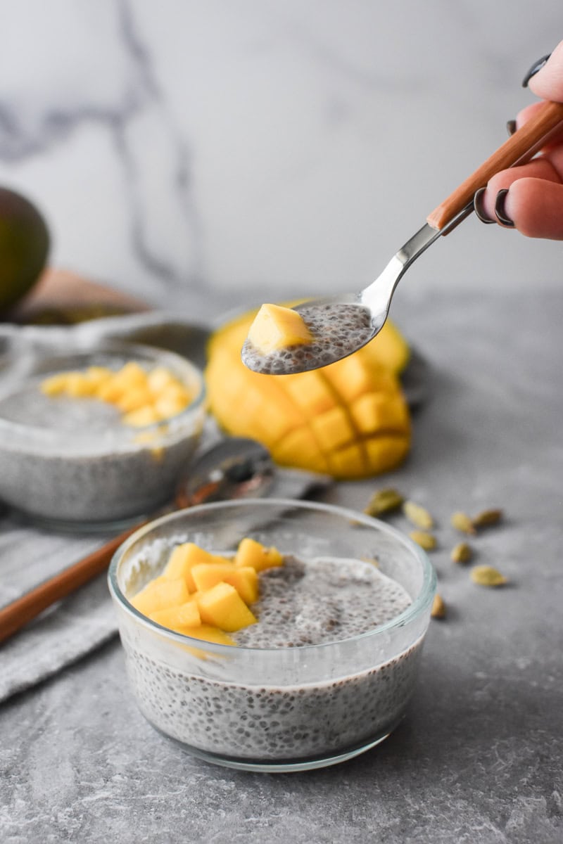 a close-up of a spoonful of Mango Cardamom Chia Pudding