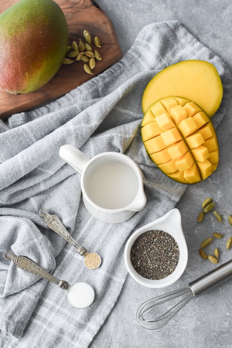 An overhead ingredient shot for Mango Cardamom Chia Pudding