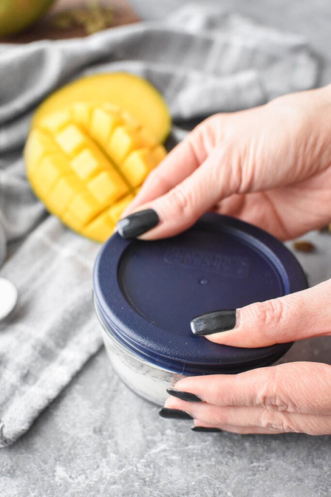 A picture showing a lid being put on a glass dish