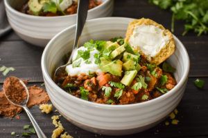 This 21 Day Fix Mole Chicken Chili is a unique and healthy twist on the classic. Packed with veggies, kid-friendly, gluten free, dairy free. #dinner #soup