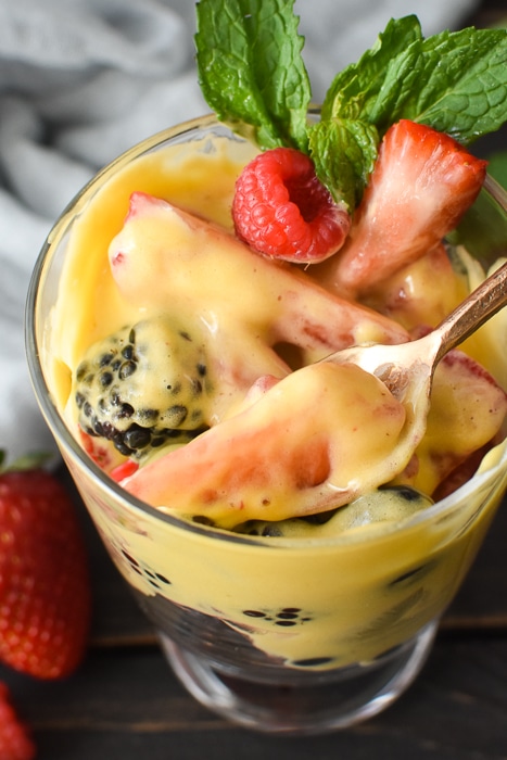 a bowl of fruit mixed with zabaglione