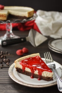 This healthy, 21 Day Fix Brownie-Bottom Cheesecake with Raspberry Sauce is the perfect make-ahead dessert for your holiday dinner or special occasion!