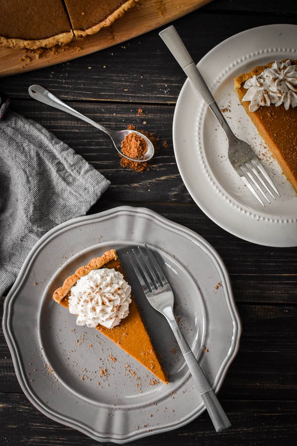 This 21 Day Fix pumpkin custard tart is my easy, delicious and healthy take on pumpkin pie. With it's pecan crust and bourbon-nutmeg coconut whip, it's the perfect dessert for Thanksgiving or any holiday!