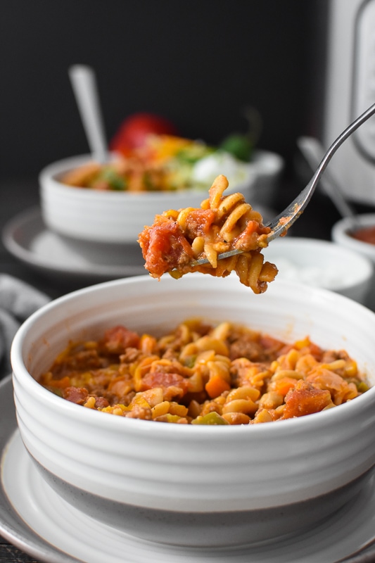 This Healthy Instant Pot Cheesy Taco Pasta is a super simple, quick and delicious dinner that the whole family will love! Kid-friendly and great for meal prepping, too! #21dayfix #instantpot #quick #easy #kidfriendly #mealprep #healthy #comfortfood #dinner #lunch