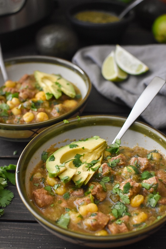This healthy Pozole Verde is the perfect fall/winter dinner! Instant Pot and Crock Pot instructions, 21 Day Fix counts and Weight Watchers Freestyle Points! #kidfriendly #weightwatchers #freestylepoints #21dayfix #healthy #healthyinstantpot #instantpot #crockpot #slowcooker #mexican #glutenfree #dairyfree #dinner #healthydinner #mealprep #weightloss