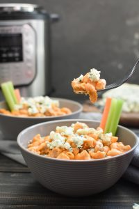 This Healthy Instant Pot Buffalo Chicken Mac and Cheese is the super quick, easy and delicious weeknight dinner you've been waiting for! #21dayfix #portionfix #weightwatchers #instantpot #healthyinstantpot #dinner #healthydinner #mealprep #lunch #healthylunch #weightloss #superbowl #gameday #potluck