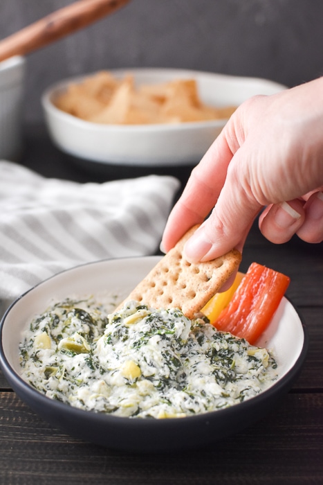 Quick Spinach and Artichoke Dip (made in Instant Pot or microwave) is the perfect last minute appetizer for any holiday or game day. Healthy, easy & delish! #21dayfix #weightwatchers #gameday #holiday #healthygameday #healthyholiday #snack #appetizer #healthysnack #healthyappetizer #mealprep #weightloss #kidfriendly #instantpot #microwave #party #partyfood #healthypartyfood