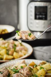 This Instant Pot Pork and Sauerkraut is so delicious and has only 5 ingredients! It makes for an easy, healthy dinner the whole family will love! #newyearsday #goodluck #21dayfix #weightwatchers #mealprep #freezermeal #5ingredients #fiveingredients #weightloss #glutenfree #dairyfree #dinner #healthydinner #easydinner #instantpot #pressurecooker #healthy #healthyrecipe