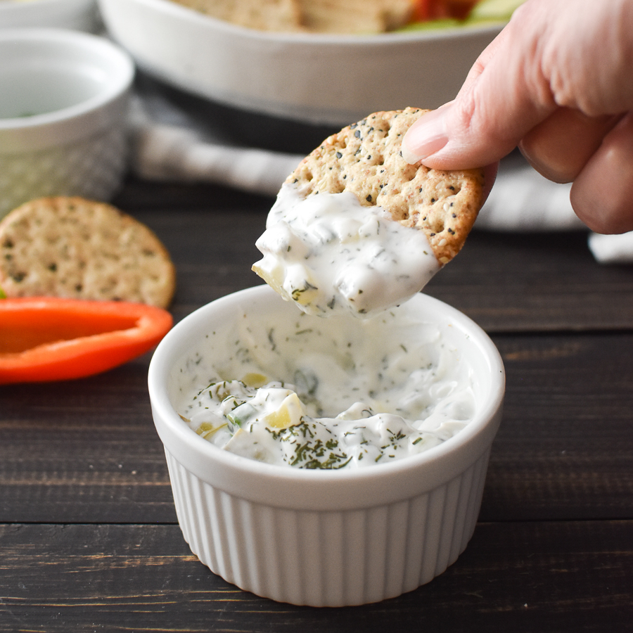 This healthy Dill Pickle Dip is quick, easy, and creamy-delicious! It's also gluten-free and packed with protein for healthy snacking! #21dayfix #UPF #weightwatchers #snacking #holiday #christmas #thanksgiving #gameday #healthygameday #glutenfree #ww #healthy #healthysnack #weightloss #kidfriendly