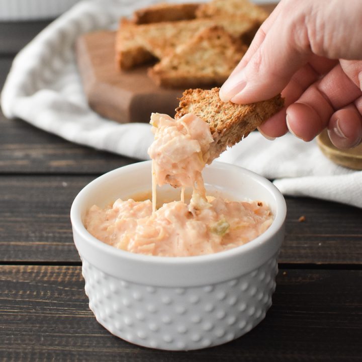 Reuben Dip in a bowl next to toast points