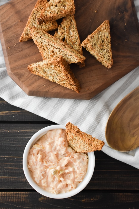 Reuben Dip in a bowl next to toast points