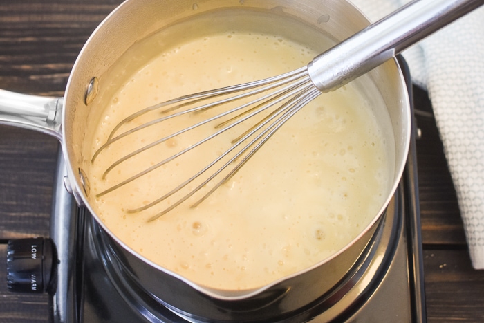 Dairy-Free Vanilla Pudding bubbling on the stove