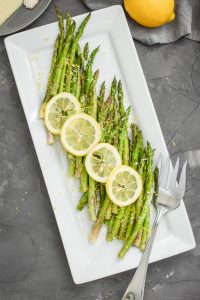 Lemon-Pecorino Air Fryer Asparagus on a white plate