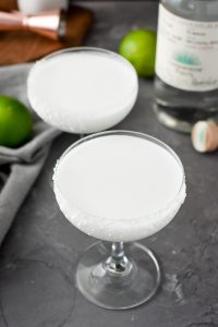 two skinny Coconut-Lime Margarita in a coupe