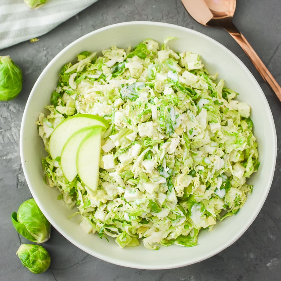 A bowl of green apple and brussels sprout slaw
