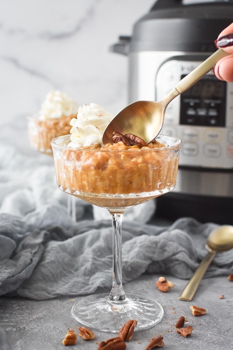 getting a spoonful of pumpkin rice pudding