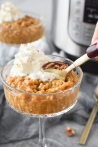 getting a spoonful of pumpkin rice pudding