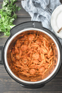 an instant pot full of pasta and meatballs
