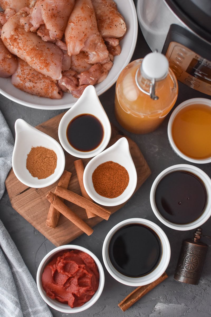 An overhead photo of all of the ingredients for Instant Pot Apple Cider BBQ Chicken.