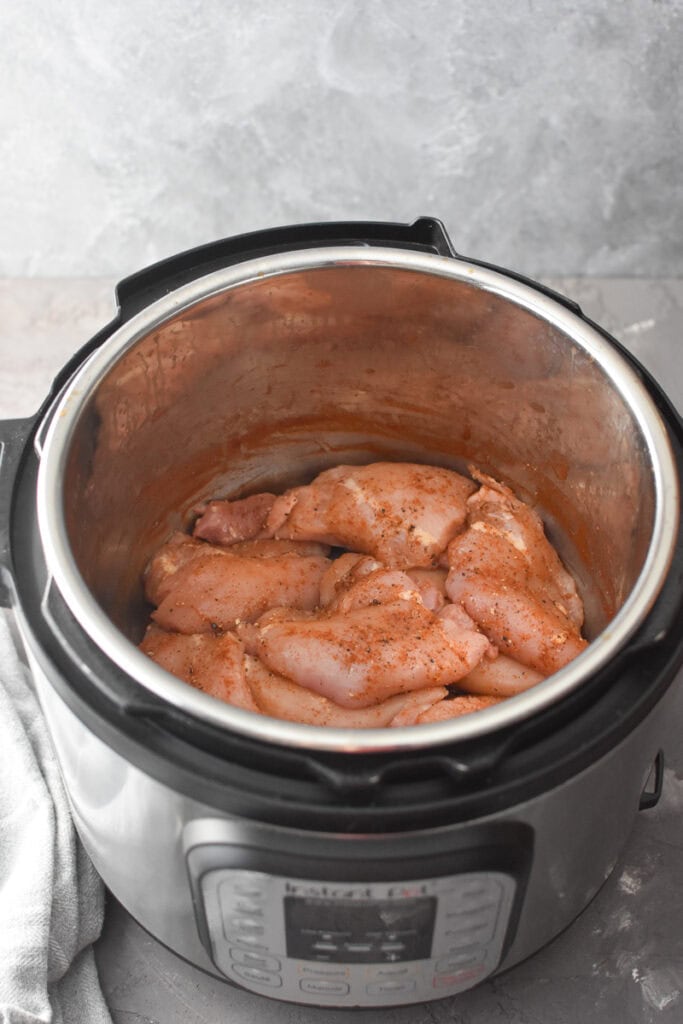 Seasoned chicken in an Instant Pot.