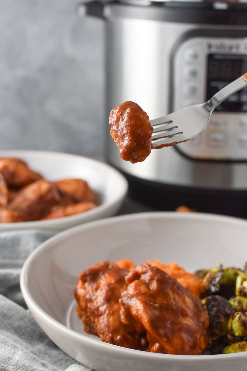A forkful of apple cider bbq chicken
